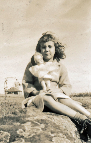 Deloris McRae, with doll
